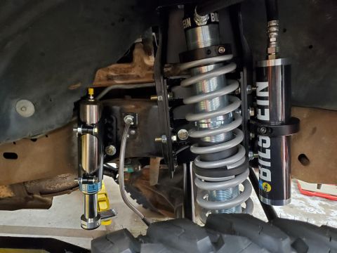 1996 Ford Bronco - Upgraded suspension components, including Bilstein shocks and coilovers, are visible on the vehicle's front end.
