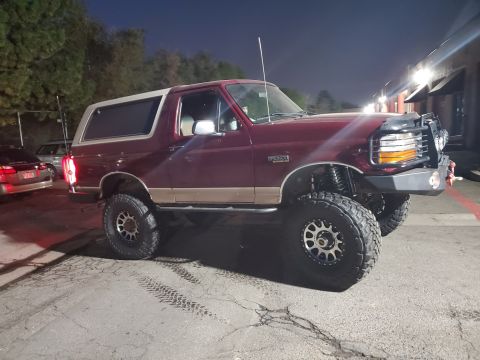1996 Ford Bronco - This modified 1996 Ford Bronco sits high on off-road tires and features a custom front bumper.