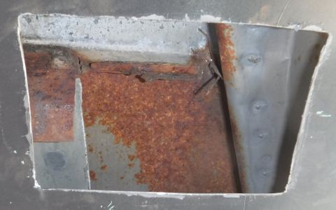 1992 Ford Bronco - B-pillar access hole cut on the passenger side. Lots of rust hiding in there!