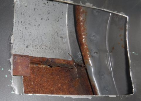 1992 Ford Bronco - B-pillar access hole cut on the passenger side. Lots of rust hiding in there!