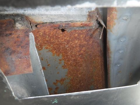 1992 Ford Bronco - B-pillar access hole cut on the passenger side. Lots of rust hiding in there!