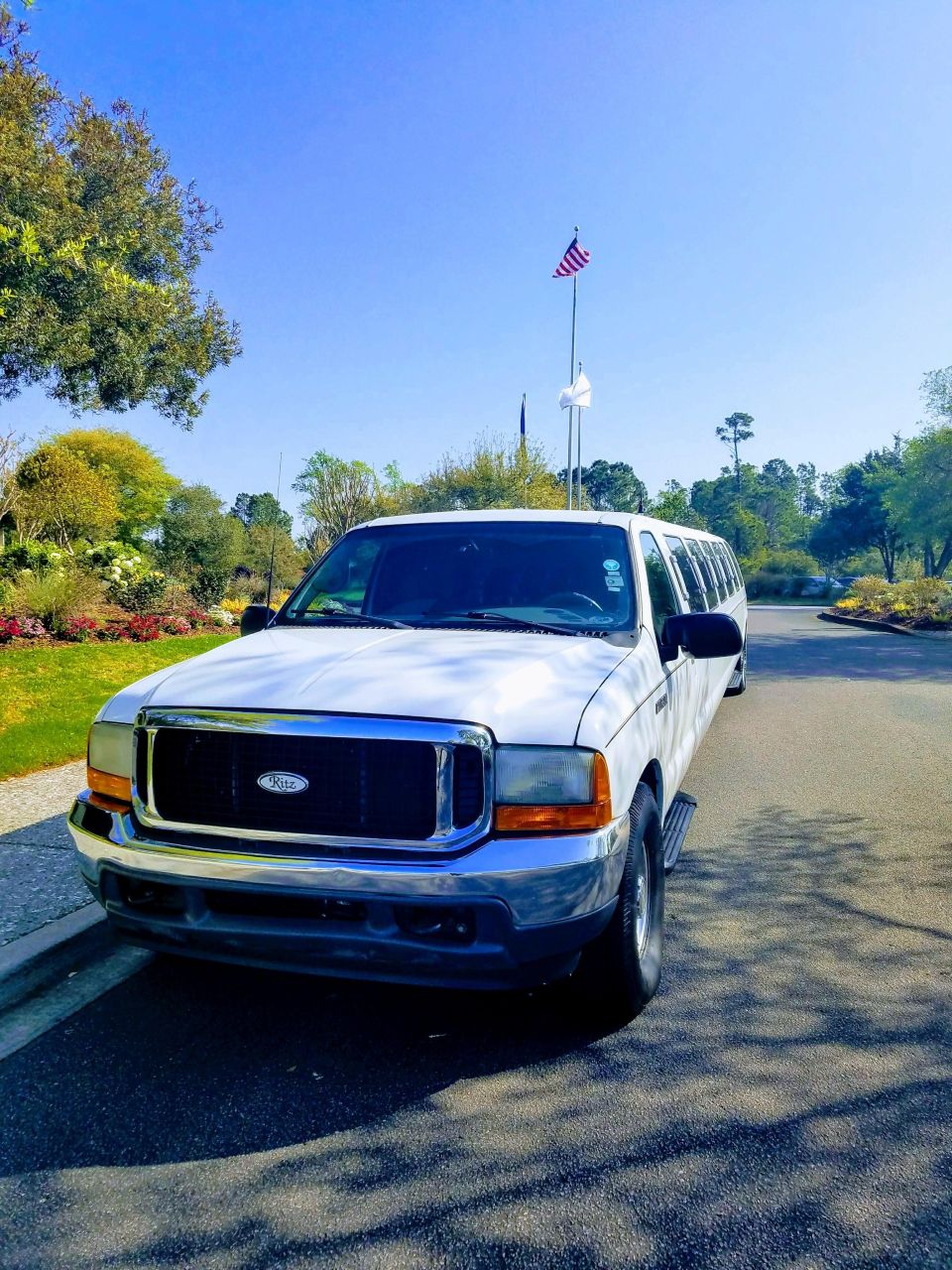 White 2000 Ford Excursion limousine, front 3/4 view