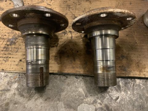 1979 Jeep CJ5 - Two front wheel hubs are shown, likely for a Jeep CJ5, with visible wear and tear.