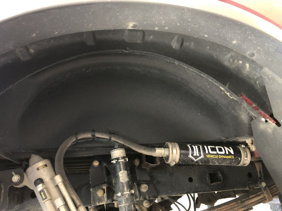 Close-up of the rear suspension with an Icon Vehicle Dynamics shock absorber