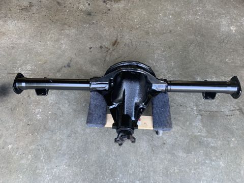 1979 Jeep CJ5 - A black rear axle assembly is shown from above, resting on gray padding.