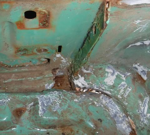 1992 Ford Bronco - Passenger b-pillar base. Under all those globs of seam sealer is some gnarly panel gap. It's almost like they designed that to be a drain .…