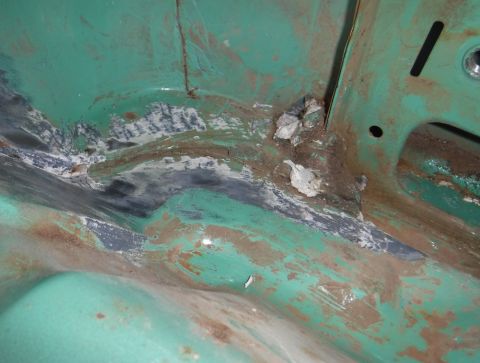 1992 Ford Bronco - Base of the driver's b-pillar. Stress cracks like this are evident everywhere in the seam sealer when you start chipping away at it. Quite…