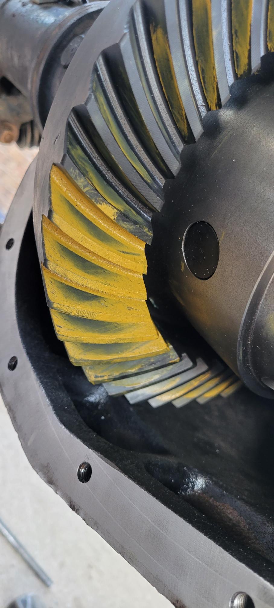 Close-up of differential gears with yellow markings