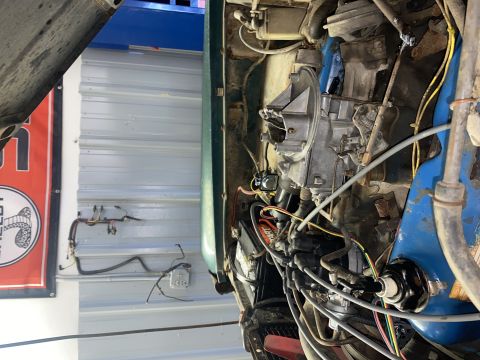 1976 Ford Bronco - Engine bay detail with carburetor and wiring harness visible. Supermotors.net logo in lower right.
