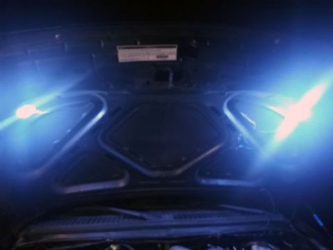 2001 Ford Excursion - The engine bay is lit with blue lights, obscuring details of the vehicle.