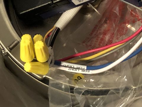 1995 Mercury Grand Marquis - Close-up view of electrical wiring connections, including yellow wire nuts and labels indicating "FOR LIGHT".