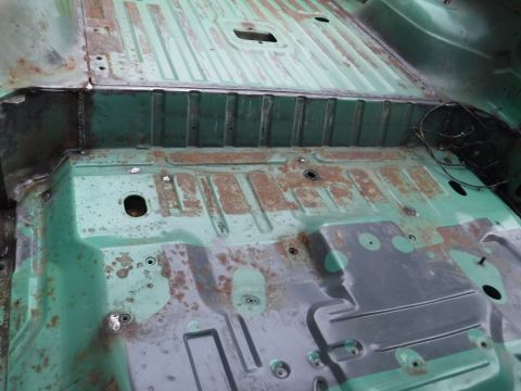 1992 Ford Bronco - Floor and bed cleaned up; most of the seam sealer removed, miscellaneous holes and rusty corroded low spots filled.