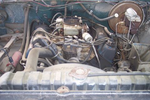 1977 Ford F-150 - Close-up of an engine bay showing various components and the radiator.