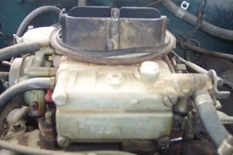 1977 Ford F-150 - The "HOLLEY" brand is visible on this engine part.