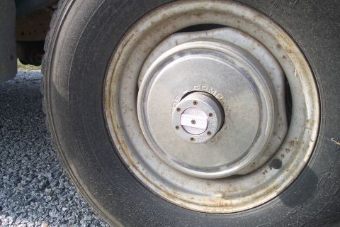 1977 Ford F-150 - Hubcap on a truck wheel shows 'DANA COMPANY' text.