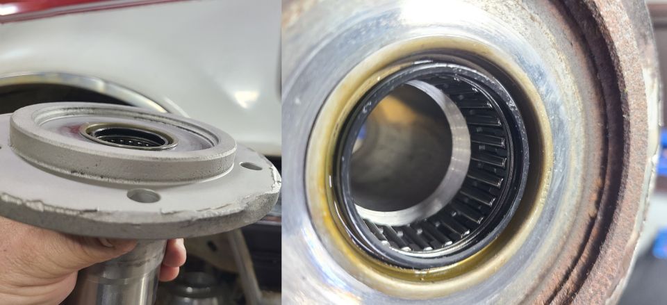 Close-up of a wheel bearing and hub assembly, showing the bearing rollers inside a housing