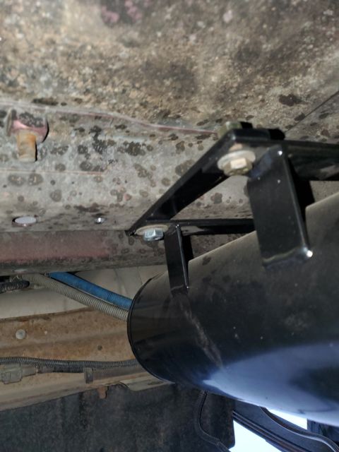 1996 Ford Bronco - Close-up view of an aftermarket air tank mounted beneath a vehicle's chassis.