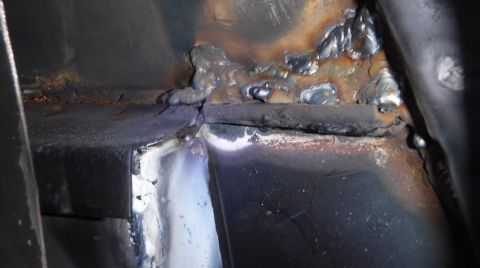 1992 Ford Bronco - Passenger side access hole. I re-sprayed Rust Reformer everywhere inside after this, so I wouldn't forget to before closing them back up...