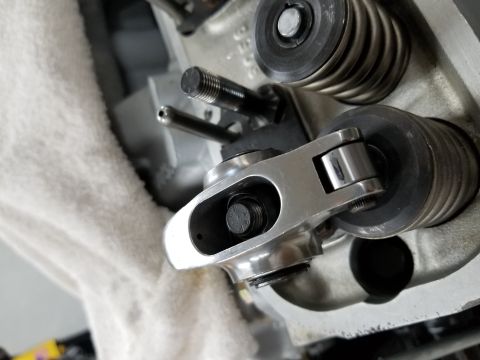 1969 Pontiac Firebird - Engine components including a rocker arm and valve spring are visible in this close-up shot.