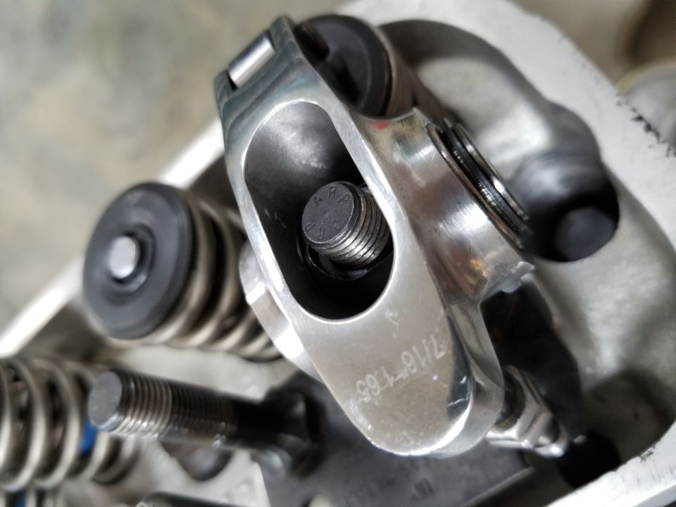 Close-up of a rocker arm and valve spring assembly from an engine