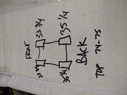1996 Ford Bronco - Hand-drawn sketch on cardboard mapping cab body-mount positions with measurements labeled front, back and 74-75.