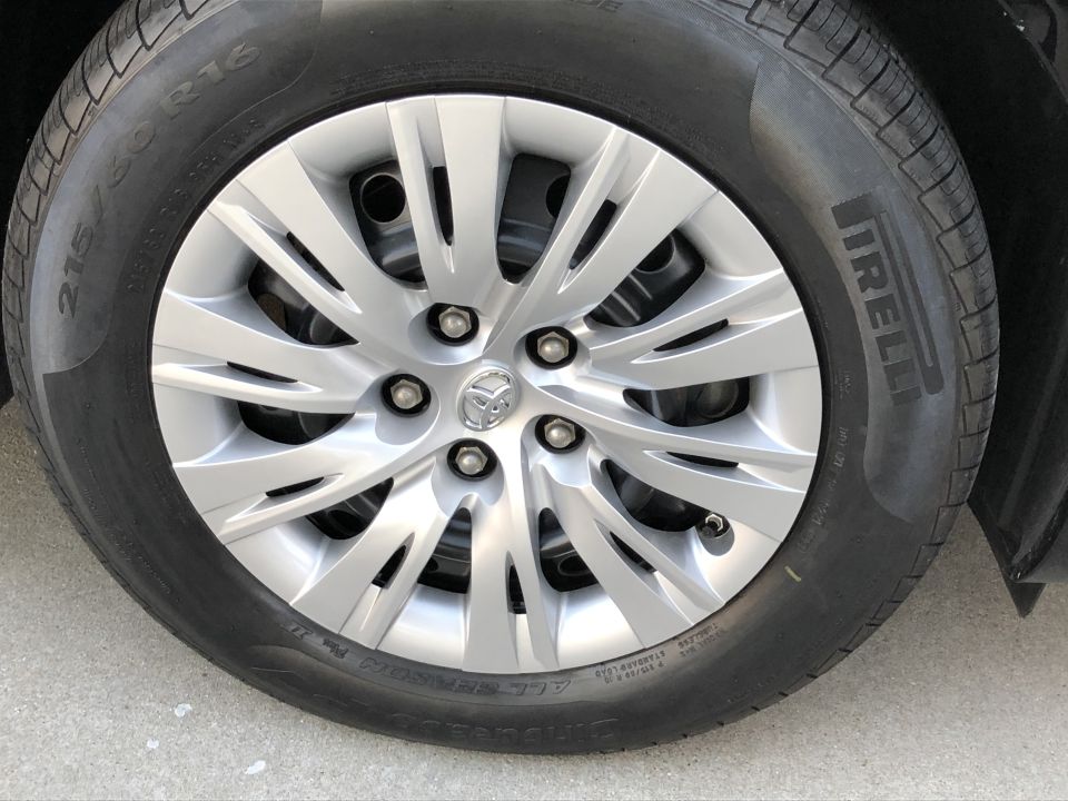 Silver Toyota Camry wheel and Pirelli tire, close-up