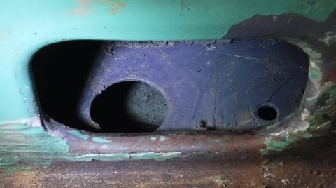1992 Ford Bronco - The big hole has a huge chunk of expanding foam pushing down below, while the smaller hole is one of the push pin spots.