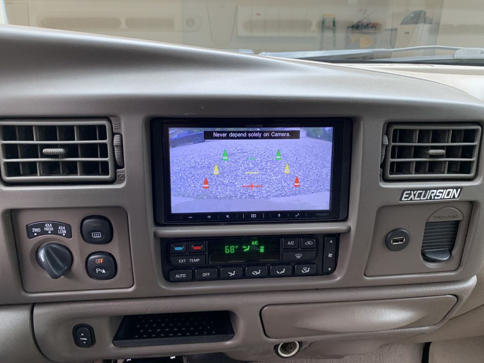 2002 Ford Excursion dashboard with backup camera display and climate controls