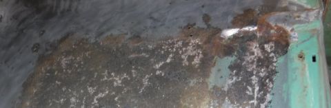 1992 Ford Bronco - I'm not sure what these screw holes were for -- there was some sort of plastic or paper, mostly disintegrated, screwed down on both sides w…
