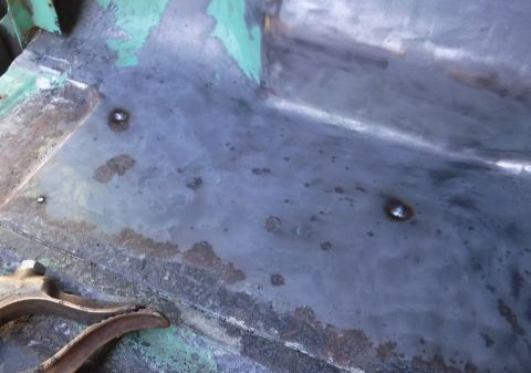 1992 Ford Bronco - Driver's side rear corner screw holes filled. The fuel filler neck passes between them, pretty close to one of them, so I was a little nerv…