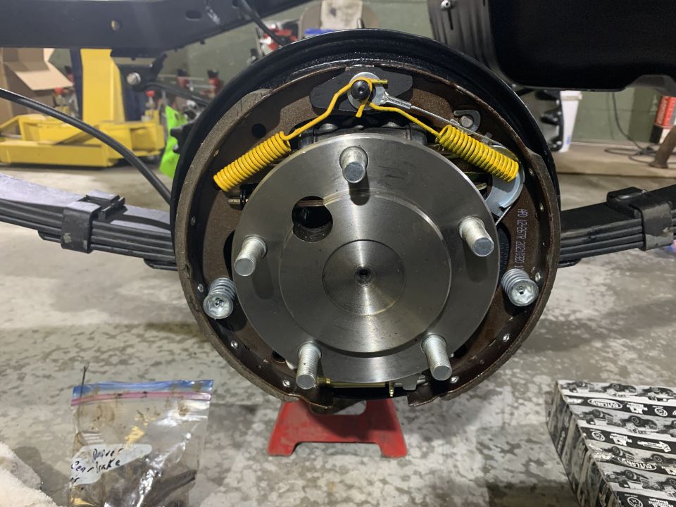 1979 Jeep CJ5 rear drum brake assembly with hub, shoes, and springs.