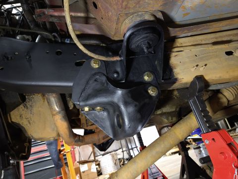 1996 Ford Bronco - This image shows a close-up view of the vehicle's frame and suspension components, including a newly installed bracket.