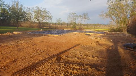1995 Ford Bronco - A construction site shows rebar and concrete forms laid out for a new foundation.
