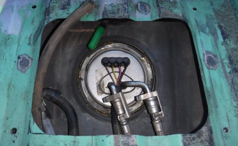 1992 Ford Bronco - Tank emptied, cleaned, and reinstalled. I had to shave down the four spot welds surrounding the cutout, so that the access panel would sit…