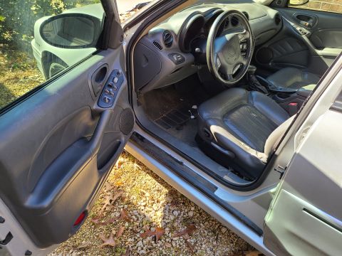 2003 Pontiac Grand Am - The right steering wheel buttons are worn so that the backlight bulb is visible, but everything seems to work. IF THE IMAGE IS TOO SMALL, c…