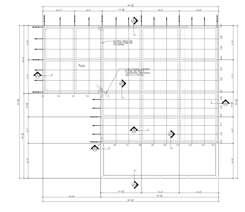 Structural slab and footing plan with dimensioned column grid and reinforcing notes