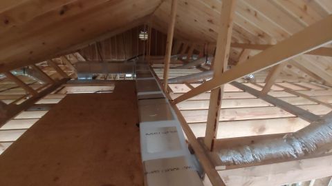1995 Ford Bronco - View of an unfinished attic space, showing construction details and HVAC components.