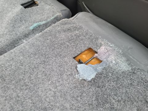 2003 Pontiac Grand Am - Wax (probably from a scented candle) appears to have melted from the rear deck down between the seatbacks & the trunk.