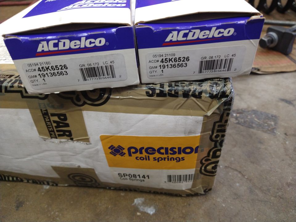 Boxes of ACDelco and Precision coil springs, one labeled SP08141