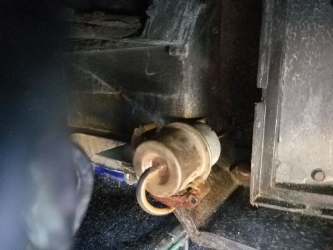 1976 Ford Ranchero - Close-up view of a heater control valve, possibly from a 1976 Ford Ranchero, showing a blue hose and wire attached.