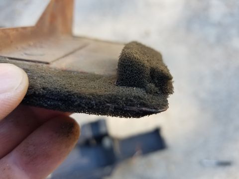 1976 Ford Ranchero - Foam seal on metal bracket, likely from a vehicle's HVAC system.