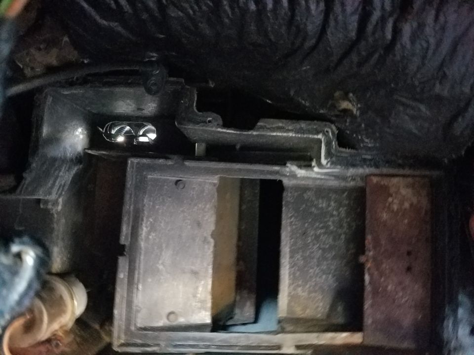 Close-up of a vehicle's heater box assembly with vents visible