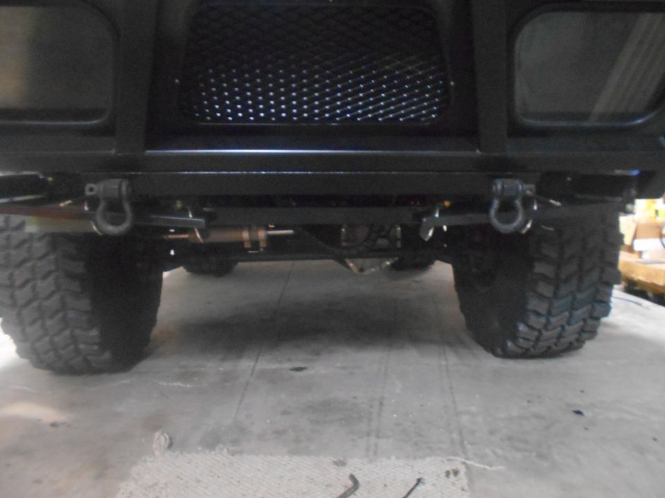 Black SUV front bumper with tow hooks and large tires