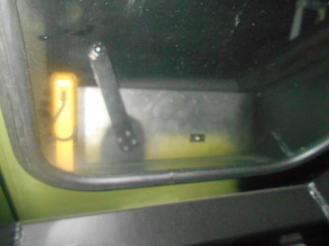 1992 Ford Bronco - A close-up shot shows a yellow object and a lever inside the vehicle's interior.