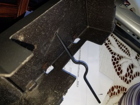 1976 Ford Ranchero - Close-up of a heaterbox assembly, with a metal rod and a diagram visible beneath it.