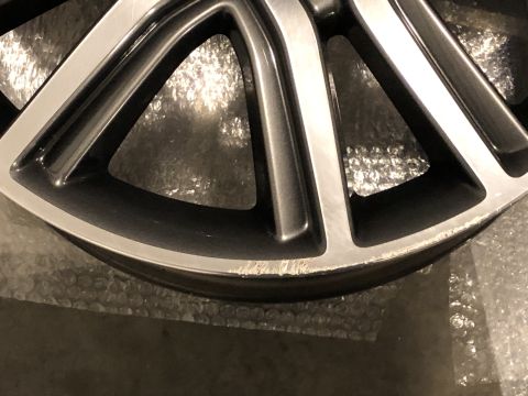 2019 Ford Everest - Close-up of a damaged alloy wheel rim showing scuff marks on the outer edge.