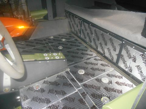 1992 Ford Bronco - Sound deadening material covers the interior floor and lower side panels of a vehicle.