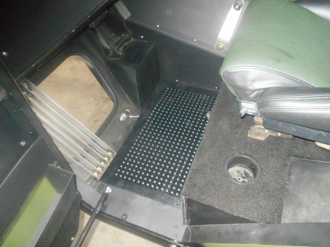 1992 Ford Bronco - Interior view of a vehicle, focusing on the floor area and a seat.