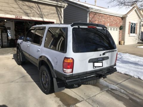 2000 Ford Explorer - 2000 Ford Explorer seen from the rear, parked in a driveway with snow on the ground.