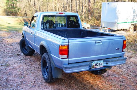1998 Ford Ranger - Rear view of a 1998 Ford Ranger pickup truck with a light blue exterior and black wheels.
